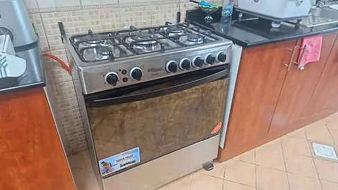 Im selling my 5-burner gas cooker with oven — stainless steel, working condition