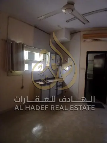 A well-located studio apartment for rent in Al Butina, Sharjah, situated in a vibrant area close to restaurants, supermarkets, and public transportati