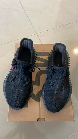 Black Yeezy-style sneakers