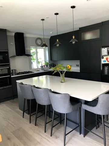 Modern dark-grey kitchen island with white quartz top
