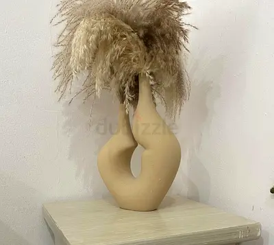 Sculptural ceramic vase with dried pampas grass
