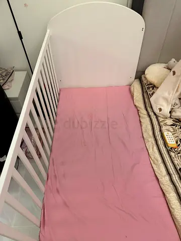 White baby crib (used) - sturdy and clean