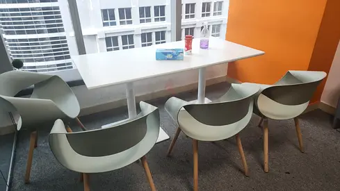 White dining table with matching modern chairs