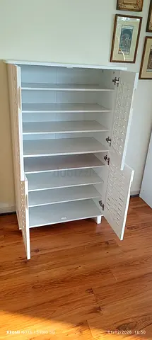 We are selling 4 door wood shoe rack brand new available