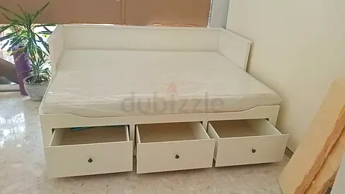 My white wooden daybed with 3 storage drawers