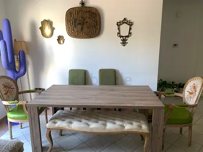 Rustic wooden dining table with tufted bench and 4 chairs