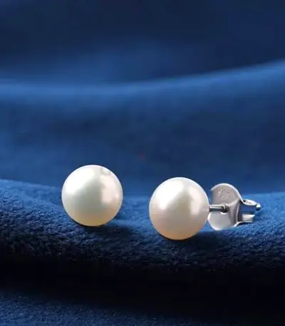 Classic white pearl stud earrings with silver backs
