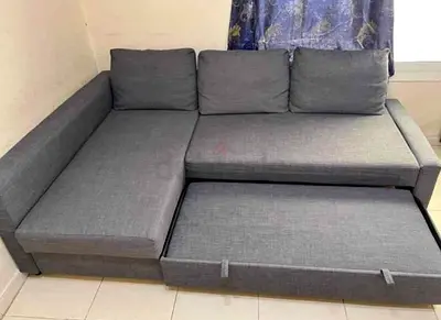 Gray L-shaped corner sofa bed with storage
