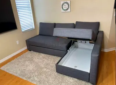 IKEA Friheten Sofa Cumbed gray L-shaped sectional sofa with storage and pull-out bed