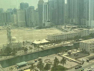 Three-bedroom apartment with a spacious living room and a pleasant open view, located in Al Majaz 3 within a modern building offering full amenities.