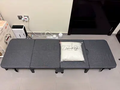 Grey folding guest bed / portable foldable futon with bedsheets