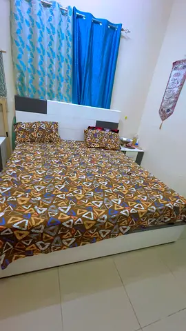 White platform double bed with headboard  bedside tables