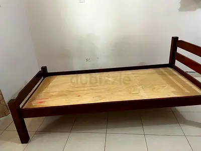 Single wooden bed with mattress