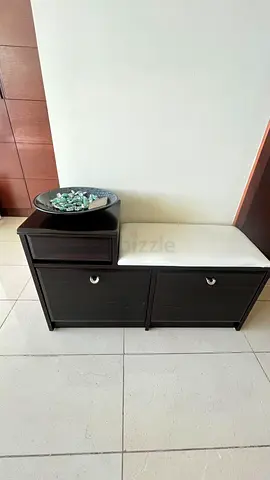 Elegant entryway shoe bench with cushioned leather seat, hidden shoe racks and drawer