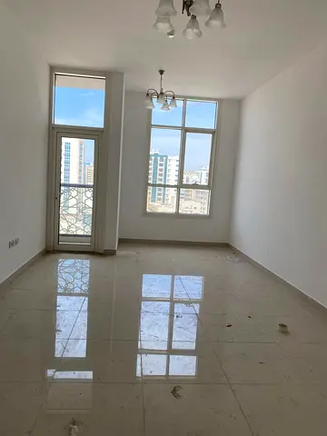 1BHK apartment in Al Qasimia, Sharjah. Spacious, balcony, central AC, near services. 39,000 AED yearly, 4-6 payments, 2,000 AED cash deposit.