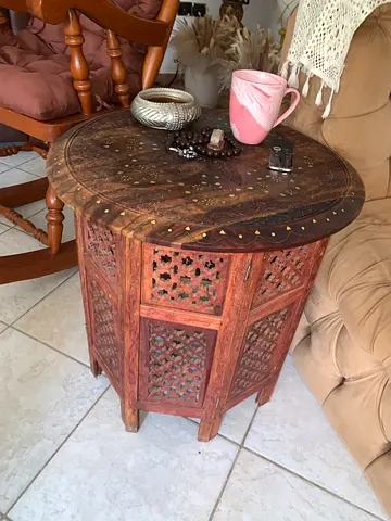 Carved Moroccan-style wooden side table