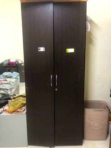 Two-door dark brown wardrobe (armoire) — used, good condition