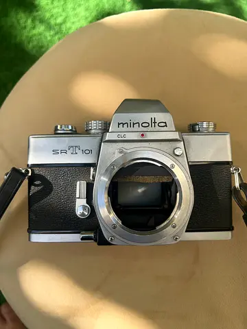 Vintage Minolta Srt 101 35mm SLR film camera (used) - body with strap