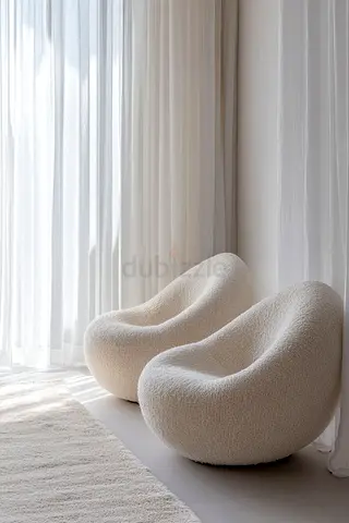 Pair of cream bouclé lounge chairs