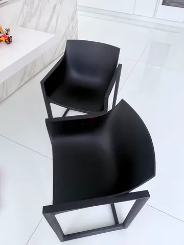 Pair of black modern dining chairs with heavey plastic frame neat and clean for sale 3 pices