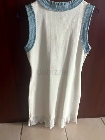 White sleeveless knit dress with denim-look trim in style of Sandro
