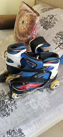 Adjustable inline roller skates — used, good condition