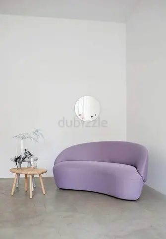 Curved lavender two-seater sofa