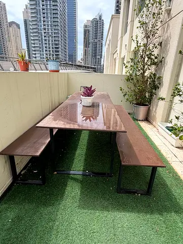Outdoor wooden picnic-style table with two benches