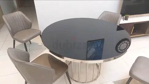 Elegant Black Round Dining Table with Unique Base