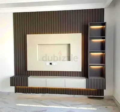 Modern wall-mounted entertainment unit with LED-lit shelves