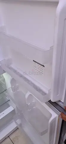 Reversible Refrigerator with Freezer Compartment