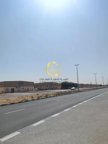For sale: large corner land in Al-Sajaa Industrial, 1,150 square meters, excellent location, entrance and exit to the UAE border, freehold ownership f