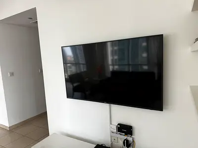 Wall-mounted flat panel TV
