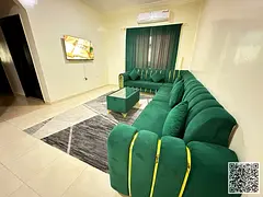 Luxury two-bedroom apartment with a living room and balcony offering an open view, available for mon