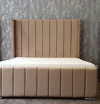 Beige King Size upholstered bed frame with tall paneled headboard