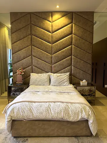 Queen-size upholstered bed with tall chevron headboard — used, good condition