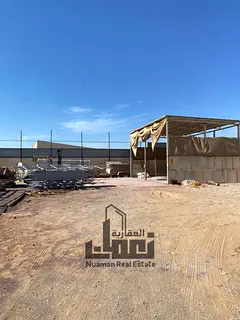 A warehouse for sale in Al-Sajaa Industrial Area with an area of 10,800 sq ft, electric power 25 KV,