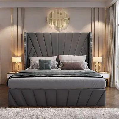 modern king size grey upholstered bed with tall padded headboard