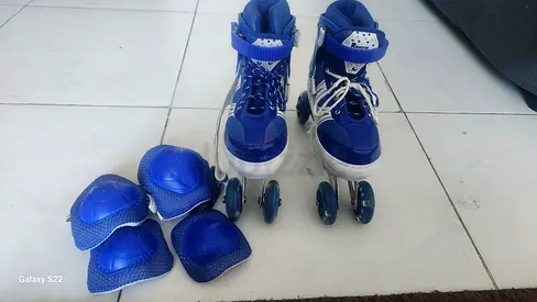 My adjustable blue inline roller skates with knee, elbow and wrist pads