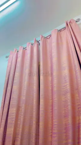 Gold-pink curtains with decorative tassel tieback