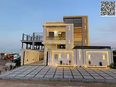 Villa for sale, including registration and ownership fees, on the main street in one of Ajman's 
