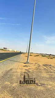 Code 107 – Corner Residential Land for Sale in Al Sahmah – Prime Location Near Park