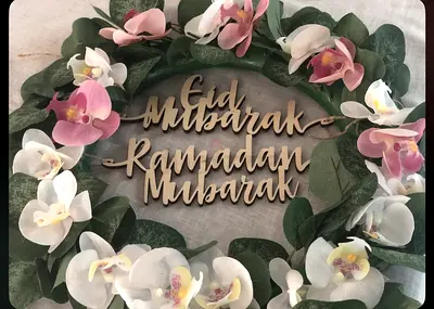 Eid  Ramadan floral wreath with wooden Eid Mubarak sign