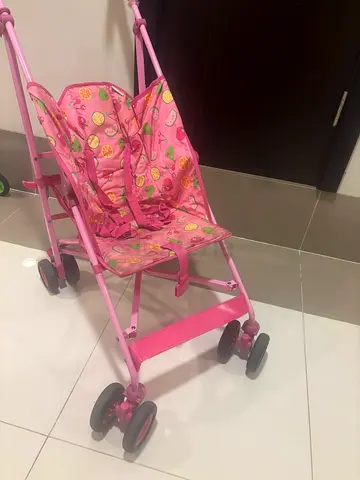 Pink foldable doll stroller - used