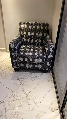Single patterned armchair - good condition
