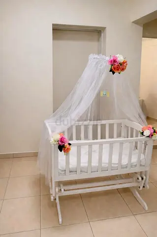 White wooden baby cradle with canopy - gently used