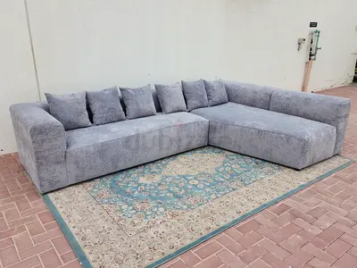 Grey L-shaped sectional sofa — spacious,