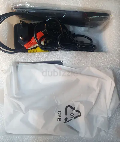 Compact media streamer box — includes AV cables  power adapter