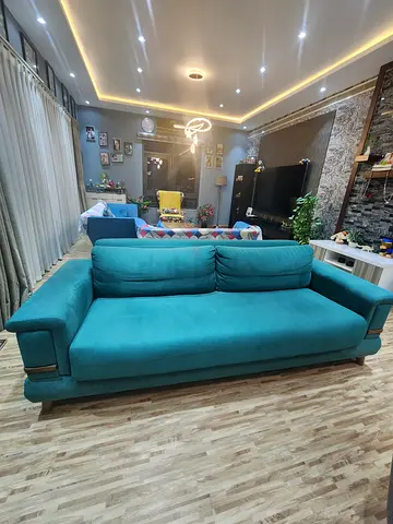 Comfortable teal 3-seater sofa cum Bed with Storage - well kept