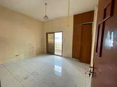 Beautiful 2-bedroom apartment for rent with a living room, central AC, front balcony, open view, and